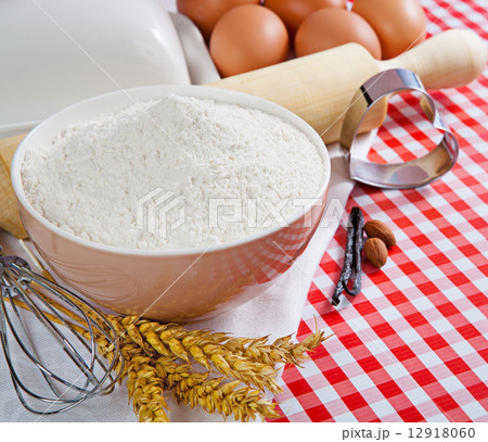 Flour and ingredients for baking in the red checkered tablecloth 12918060