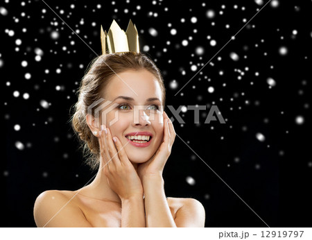 smiling woman in evening dress wearing crown 12919797