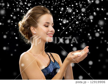 smiling woman in evening dress with diamond 12919906
