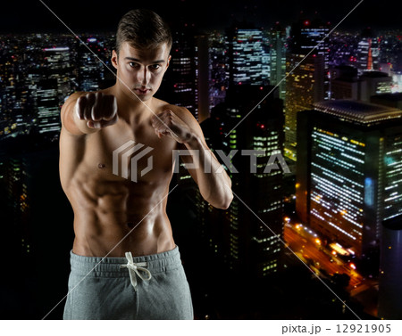 young man in fighting or boxing position young man in fighting or boxing position 12921905