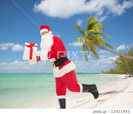 man in costume of santa claus with gift box man in costume of santa claus with gift box 12921993