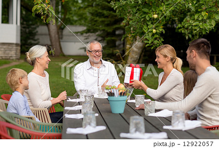 happy family having holiday dinner outdoors 12922057