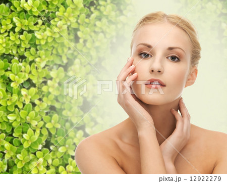 beautiful young woman touching her face skin beautiful young woman touching her face skin 12922279