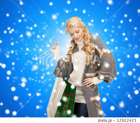 smiling young woman with shopping bags smiling young woman with shopping bags 12922425