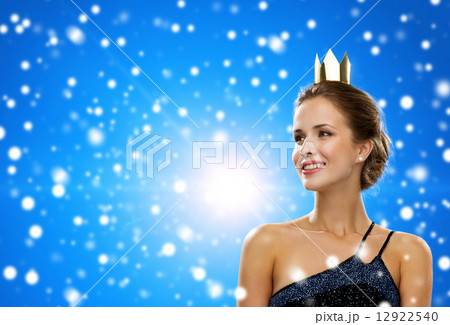 smiling woman in evening dress wearing crown 12922540