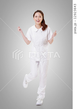 Cheerful Asian nurse Cheerful Asian nurse 12923643