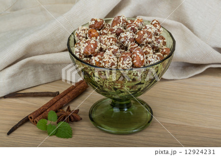 Peanut in honey with sesame seeds Peanut in honey with sesame seeds 12924231