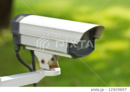 Close up of security surveillance camera isolated on green backg 12929607