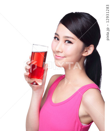 Young happy woman drink juice 12931283