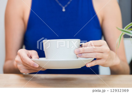 Holding a cup 12932369
