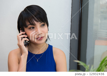 Woman talking on the phone Woman talking on the phone 12932436