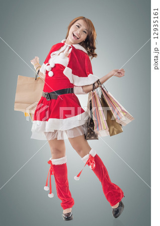 Asian Christmas girl hold shopping bags 12935161