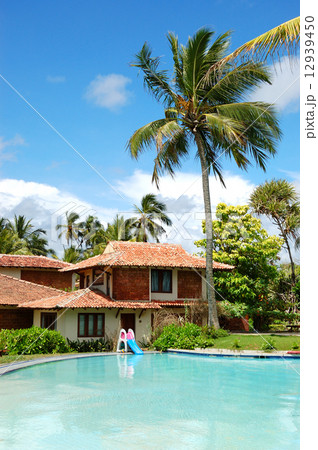 Swimming pool near villa at the popular hotel, Bentota, Sri Lank Swimming pool near villa at the popular hotel, Bentota, Sri Lank 12939450