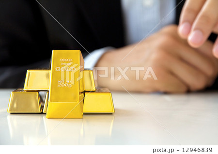 Hand hold gold bars 12946839