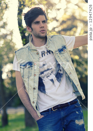 Attractive young handsome man, model of fashion in urban backgro Attractive young handsome man, model of fashion in urban backgro 12947426