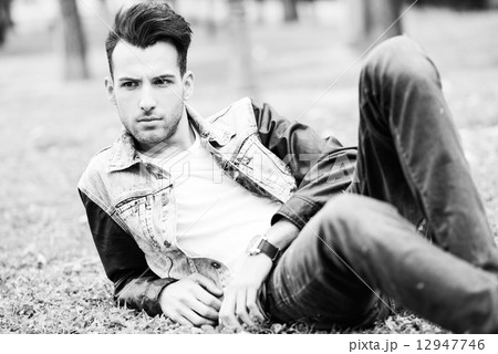 Attractive young handsome man, model of fashion in urban backgro Attractive young handsome man, model of fashion in urban backgro 12947746