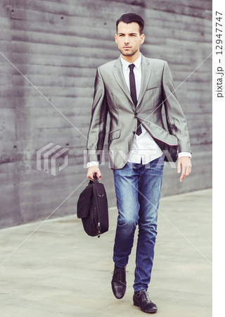 Young businessman near a office building 12947747