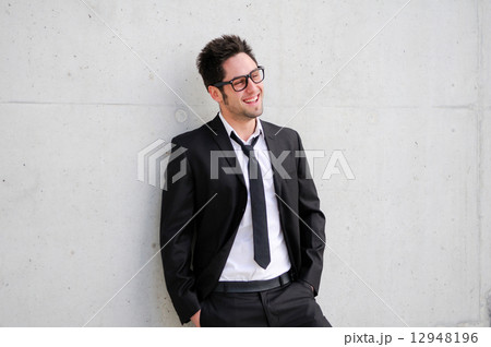 Portrait of a handsome young businessman smiling Portrait of a handsome young businessman smiling 12948196