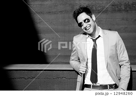 Portrait of a handsome young businessman laughing Portrait of a handsome young businessman laughing 12948260