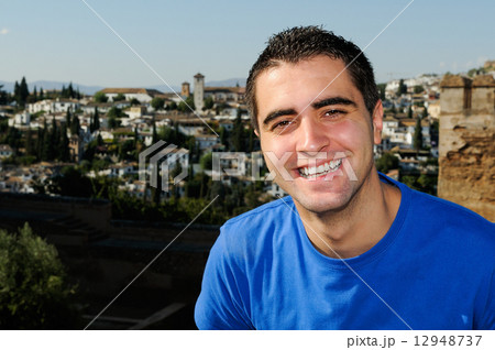 Attractive smiling man portrait in urban background 12948737