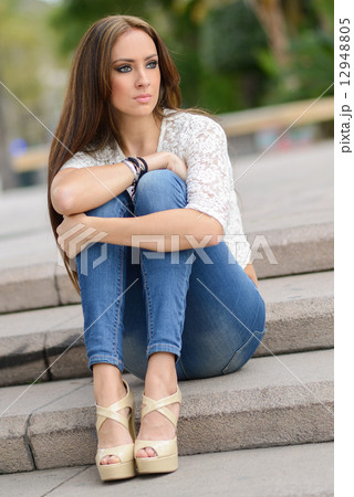 Young woman, wearing casual clothes, with long hair Young woman, wearing casual clothes, with long hair 12948805