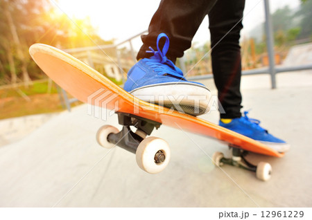 skateboarding legs at skatepark 12961229
