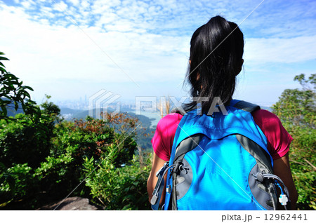 hiking woman enjoy the beautiful view at mountain peak  12962441