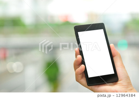 woman hand hold smart phone in modern city woman hand hold smart phone in modern city 12964384