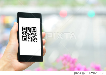 woman hand hold smart phone in modern city  12964385