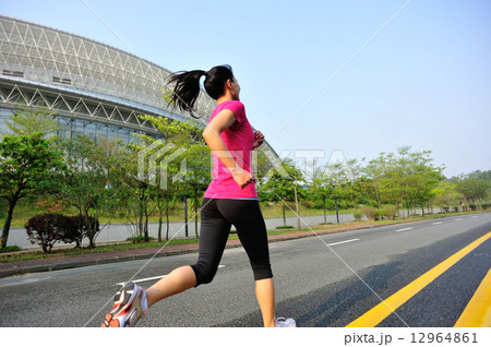 young fitness woman running at city street young fitness woman running at city street 12964861