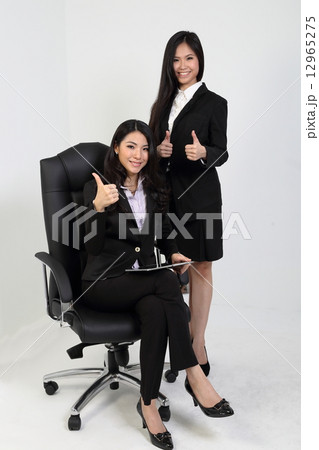 Woman standing lady sitting thumbs up 12965275