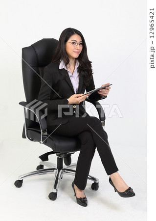 Woman in glasses with PDA looks straight 12965421