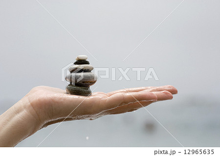 Gravel pile in woman hand Gravel pile in woman hand 12965635