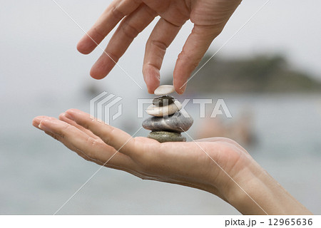 Gravel pile in woman hand Gravel pile in woman hand 12965636