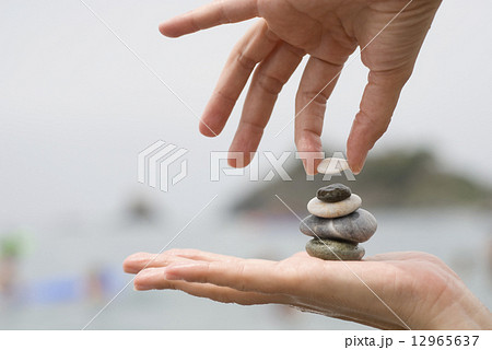 Gravel pile in woman hand 12965637