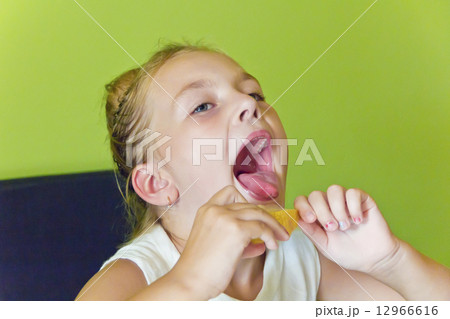 Cute girl eating melon Cute girl eating melon 12966616