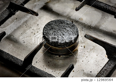 Dirty gas burner closeup Dirty gas burner closeup 12969564