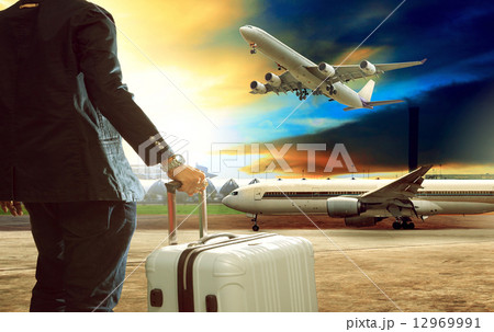 jet plane flying over runways and beautiful dusky sky with copy 12969991