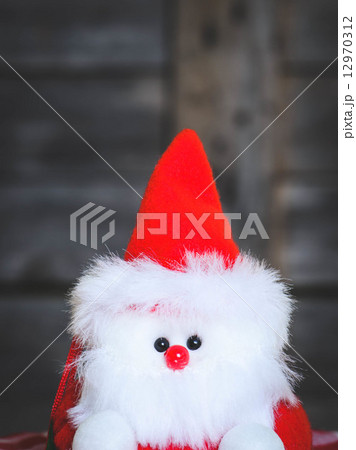 Santa doll with wooden background. Santa doll with wooden background. 12970312