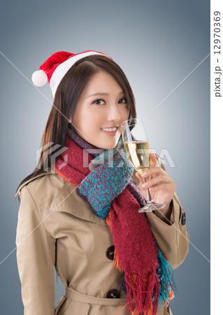 Smiling Asian woman hold a glass of champagne Smiling Asian woman hold a glass of champagne 12970369