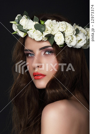 Sensuality. Young Brunette wearing Wreath of Roses 12973374