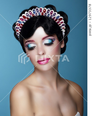 Luxurious Dreamy Female with Bright Makeup and Art Diadem Luxurious Dreamy Female with Bright Makeup and Art Diadem 12973378