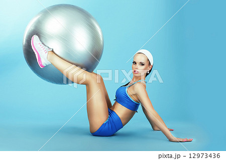 Training. Athletics. Woman in Sportswear with Fitness Ball Training. Athletics. Woman in Sportswear with Fitness Ball 12973436