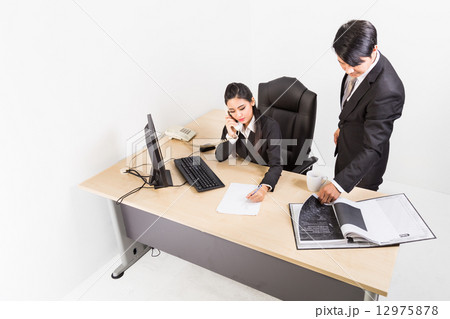 Two business people in serious discussion  12975878