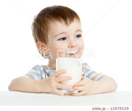child drinking milk from glass child drinking milk from glass 12976520