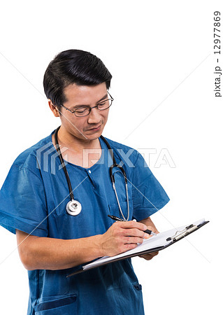 Surgeon writing a report Surgeon writing a report 12977869