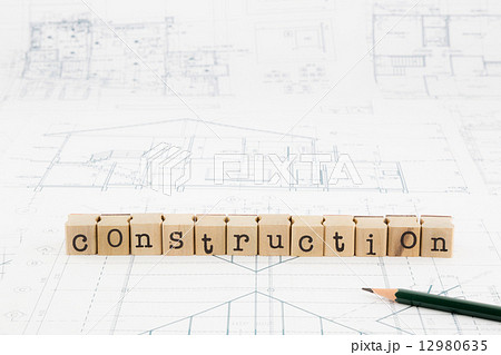 construction word blocks stack on blueprints and floor plan construction word blocks stack on blueprints and floor plan 12980635
