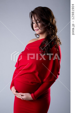 Studio shot of elegant pregnant woman 12981904