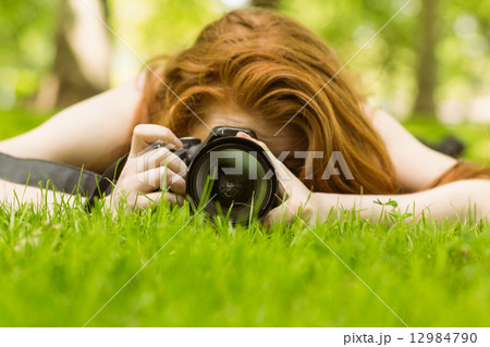 Female photographer at the park Female photographer at the park 12984790