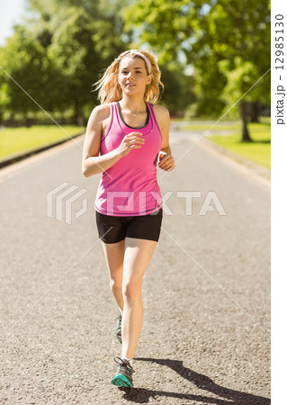 Fit blonde jogging in the park 12985130